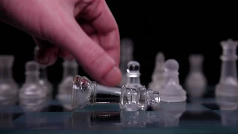 Hand dropping chess king resign lost game  Stock Footage 150457647