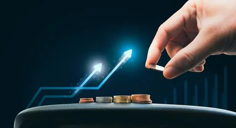 Hand is dropping coin on stack of coins with growing arrow Stock Photos