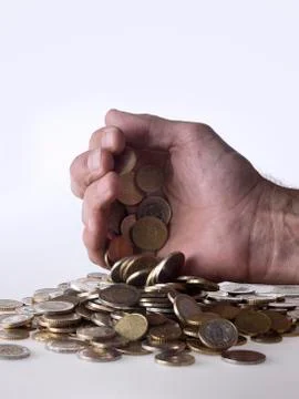 Hand dropping coins Stock Photos