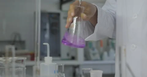 Hand With Dropping Liquid To Test Tube (4K) Stock Footage 61386879