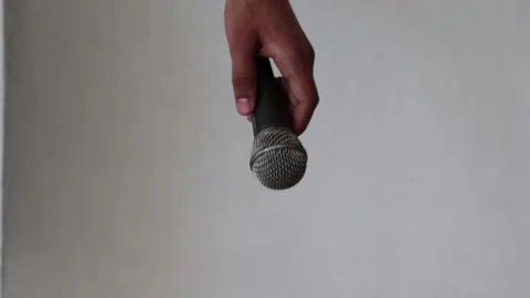 Hand dropping the microphone Stock Footage 154091075
