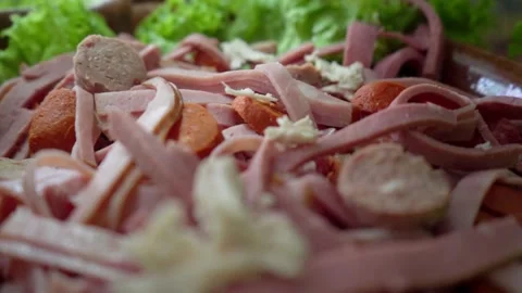 Hand dropping shredded chicken over Guatemalan fiambre during traditional prepar Stock Footage 318505317