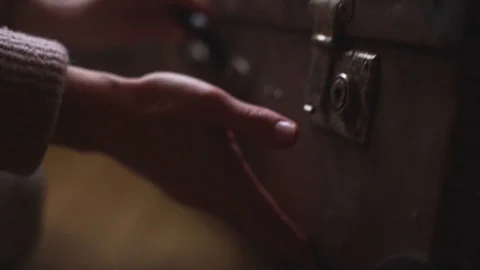 Hand drops vintage suitcase to floor and opens it close-up in slow motion Stock Footage 103205053