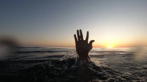 Hand of a drowning man in the sea Stock-Footage 117928077