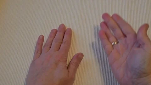 Hand drumming on table white background Stock Footage 336061942