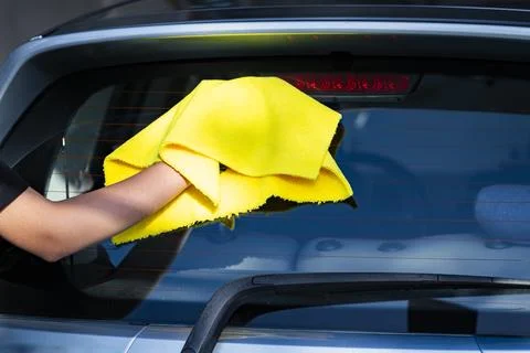 Hand Drying a Car with Microfiber Cloth After Washing 写真素材