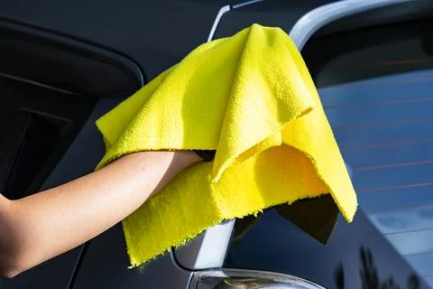 Hand Drying a Car with Microfiber Cloth After Washing Stock Photos