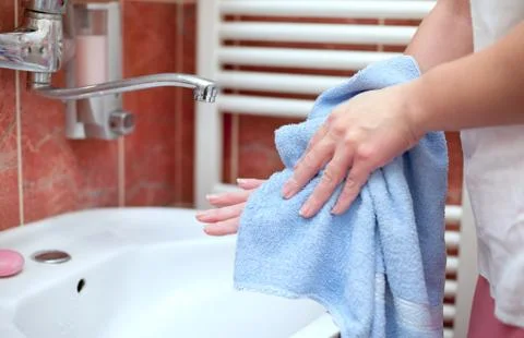 Hand drying with towel Stock Photos