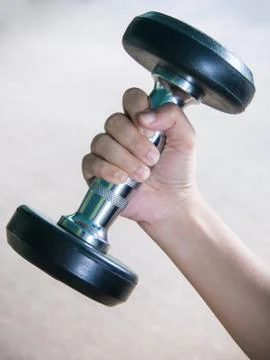 Hand with dumbbell Stock Photos