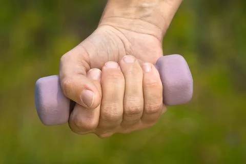 Hand with dumbbell Stock Photos