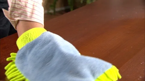 Hand duster wipes and cleans countertop or wood Stock Footage 123849470