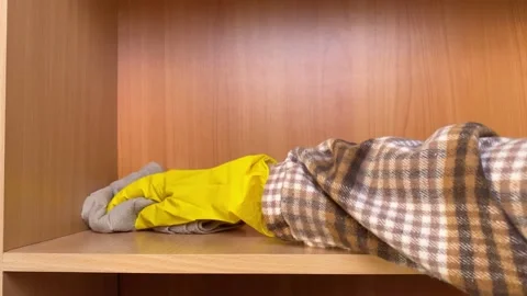 Hand dusting wooden shelf. Stock Footage 168345521