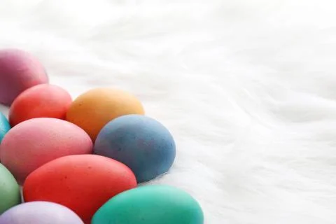 Hand Dyed Easter Eggs on Fluffy White Background Stock Photos