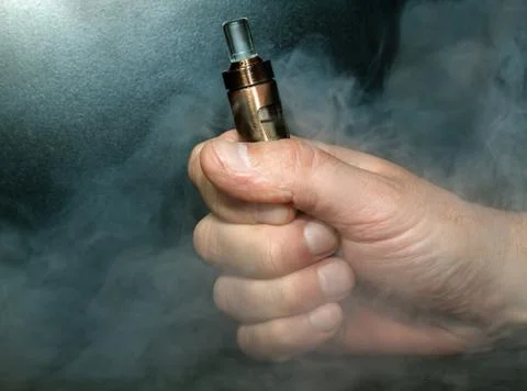 Hand with electronic cigarette Stock Photos