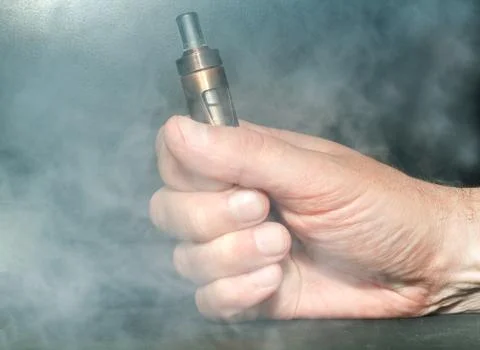 Hand with electronic cigarette Stock Photos