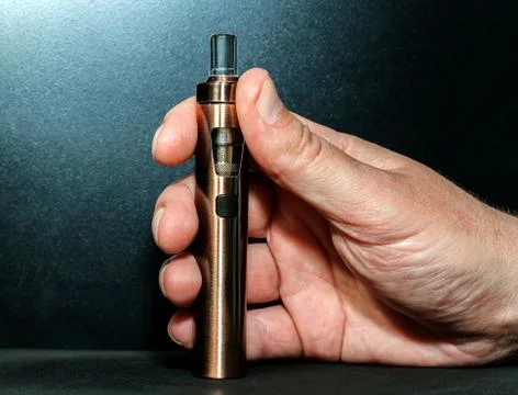 Hand with electronic cigarette Stock Photos