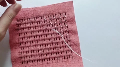 Hand Embroidering a Geometric Sashiko Pattern.  Stock Footage 344923447