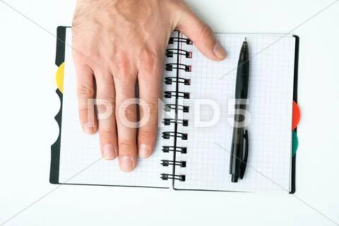 Hand on empty notepad Stock Photos