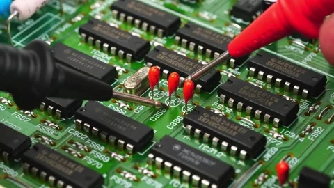 The hand of the engineer measures the voltage on the electrical board Stock Footage 169242943