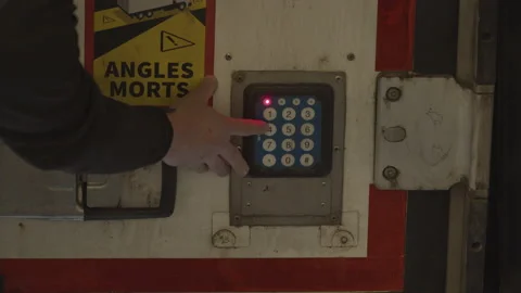 Hand entering code on panel on back of truck Stock Footage 201652578