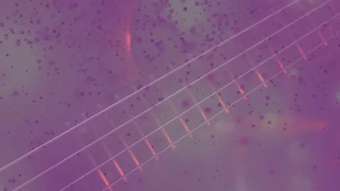 Hand entering from left, plucking strings on fretboard and making purple speckle Stock Footage 331084981