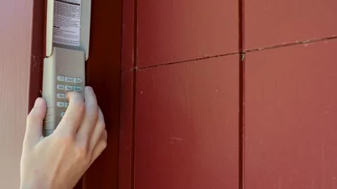 Hand Entering Security Code on Door Keypad Stock Footage 337119603