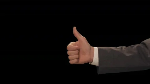 Hand enters with Thumbs Up Stock Footage 754518