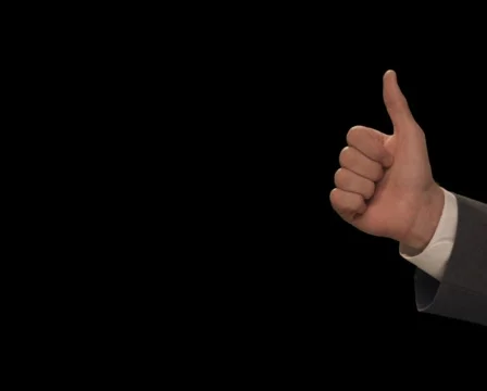Hand enters with Thumbs Up Stock Footage 754519