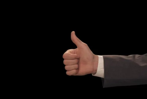 Hand enters with Thumbs Up Stock Footage 754520