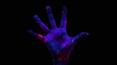 The hand is an equalizer. 4K. Projection of musical graphics on a 3D palm. Stock Footage 168355305