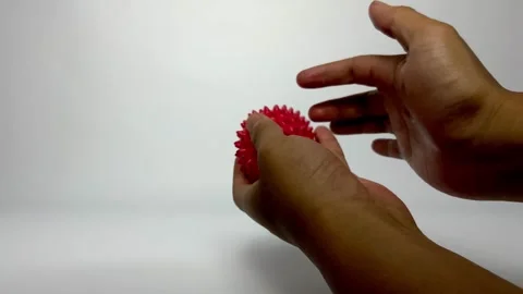 Hand Exercise with Spiky Sensory Ball for Physical Rehabilitation Stock Footage 329677487