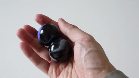 Hand exercising with rotating Baoding balls for relaxation and dexterity Stock Footage 256079465