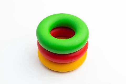 Hand expander in the form of colored rubber rings of different density Stock Photos