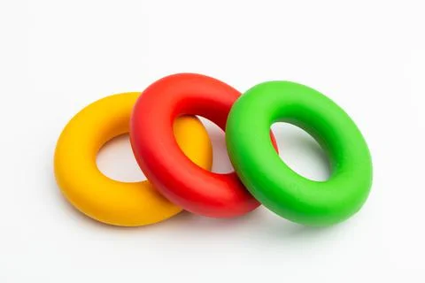 Hand expander in the form of colored rubber rings of different density Stock Photos