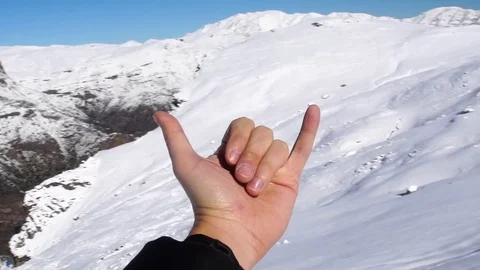 Hand Expressing Positivity on the Top of the Mountain Stock Footage 76916330