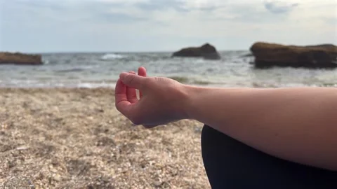 A hand extends gracefully during yoga meditation. Yoga and inner peace concept Vídeo Stock 336596527
