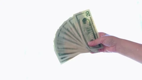 Hand fanning stack of twenty dollar bills Stock Footage 332379295