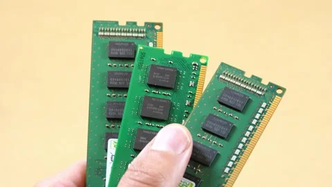 Hand fanning three green RAM memory sticks, closeup technology concept for .. Stock Footage 339372912