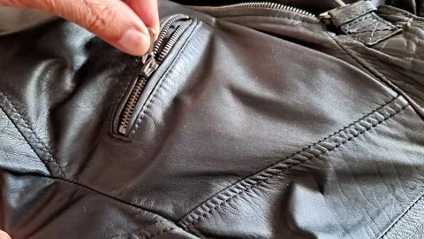Hand Fastens Black Leather Jacket Zipper Close Up Indoor Detail 스톡 동영상 343215805