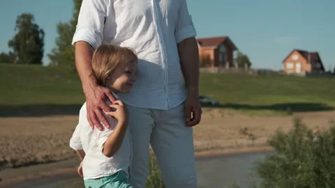 The hand of the father embraces the son. Stock Footage 248894565