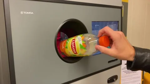 Hand feeding automatic plastic bottle recycling machine. Video stock 163160749