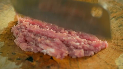 Hand female chef using knife chopping pork Stock Footage 103318594