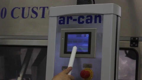 The hand of a female operator changes the settings of a conveyor belt Stock Footage 128643025