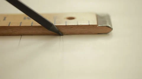 Hand of female tailor drawing pattern at paper in her studio. Close up Stock Footage 58050768