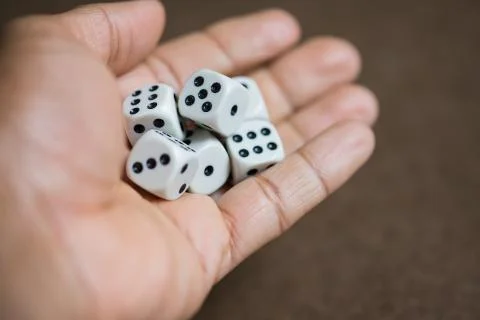 Hand fill with dice, ready to throw dice. Stock Photos