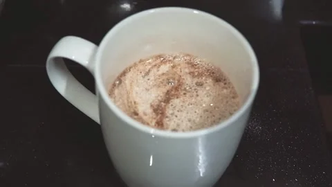 Hand fill a hot water inside a cup with instant coffee powder Stock Footage 143894203