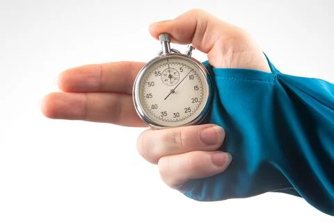 Hand with finger direction pointer and mechanical stopwatch on white backgrou Foto stock