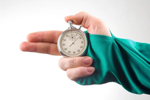 Hand with finger direction pointer and mechanical stopwatch on white backgrou Foto stock