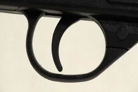 Hand - Finger pulls rifle gun trigger pull 16x9 Stock Footage