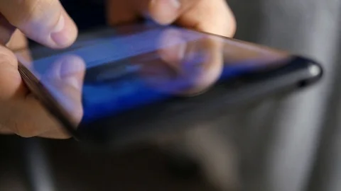 The hand (finger) work with phone touchscreen. Close up macro view Stock Footage 126773999